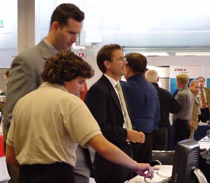 Interested visitors at  ARTES table.